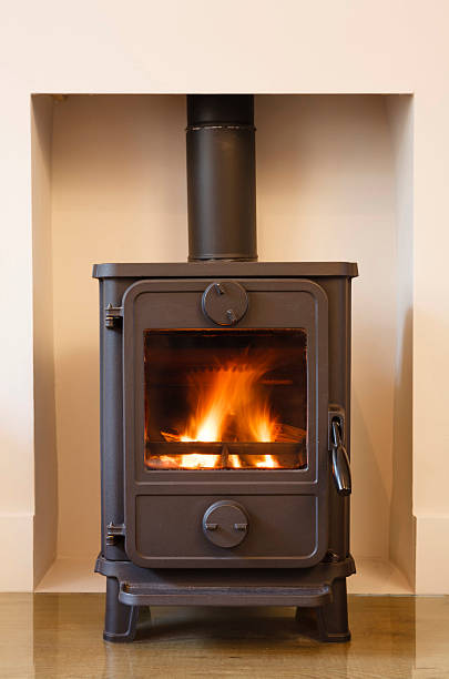 istock Wood-burning stove against beige wall 150856711