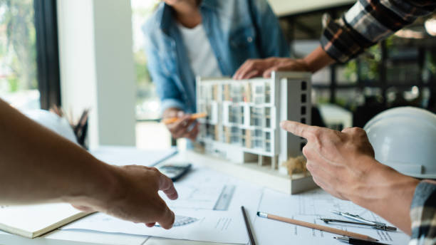istock Group of engineer is discussion and brainstorming about condominium model of construction project 1508581191