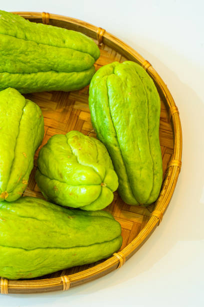 freshly picked chayote or sechium edule on basket - creole food food studio shot nobody imagens e fotografias de stock