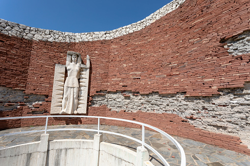 Perushtitsa, Bulgaria - 01 July 2023: The monument of the three generations rises on the historical hill Manyovo Bardo, Vlasevitsa peak, above the city center