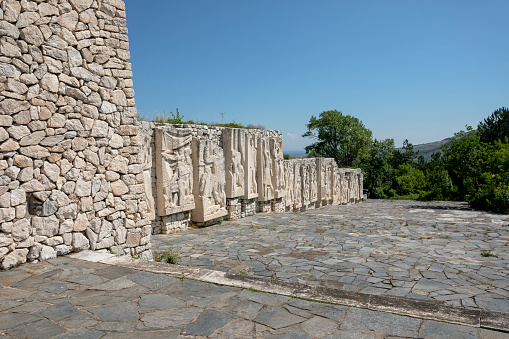 Perushtitsa, Bulgaria - 01 July 2023: The monument of the three generations rises on the historical hill Manyovo Bardo, Vlasevitsa peak, above the city center