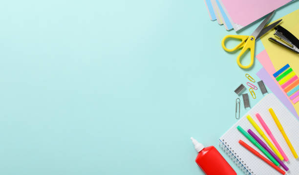 istock Back to school concept. Stationery for school on a blue background. Top view, empty advertising space on the left 1508617917