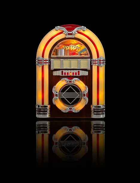Retro jukebox record player isolated on black background with reflection