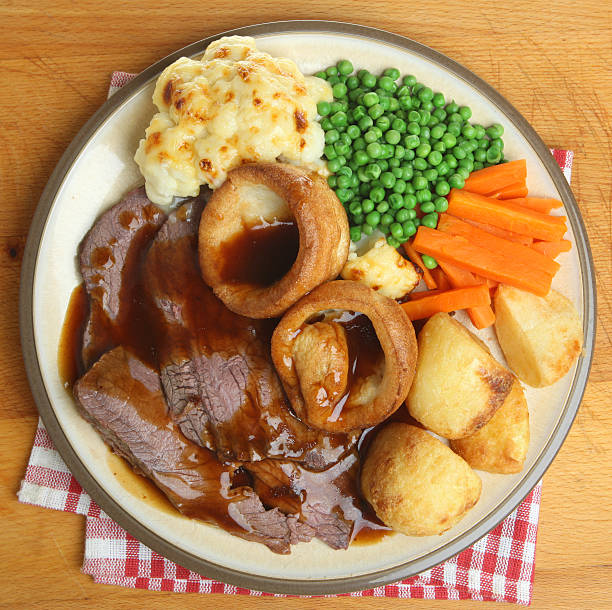Sunday roast beef dinner with Yorkshire pudding, vegetables stock photo