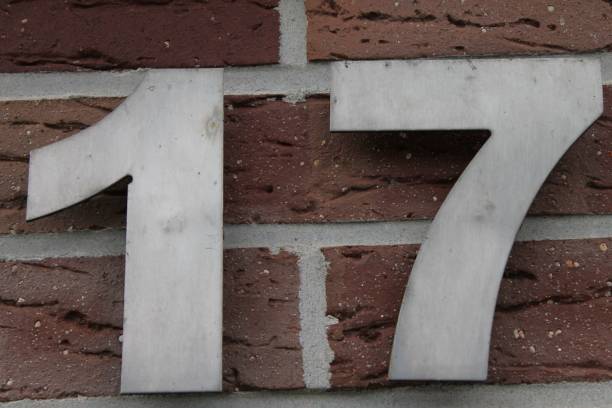 istock a house number in front of a brick wall with numbers 17 on it 1508685222