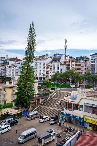 Da Lat, Viet Nam - 3 June 2023: View from above to the traffic jam at the Vietnamese street market, Da Lat is one of the tourist and entertainment cities in Vietnam