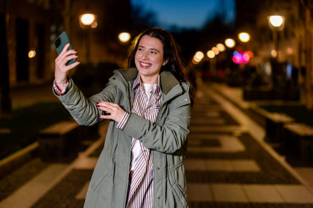 istock Young Woman Takes a Selfie on a Nighttime Stroll 1508714792