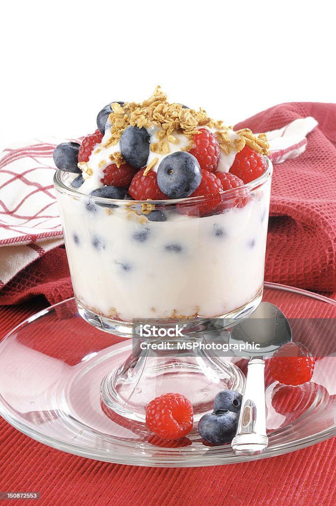 Yogurt berry parfait A healthy yogury parfait with organic granola, blueberries and raspberries Backgrounds Stock Photo