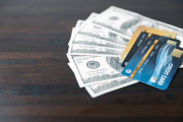 istock Business professional at work desk using a credit card calculator to manage finances, plan budgets, and analyze financial data efficiently. Technology tools for effective financial management. 1508764373