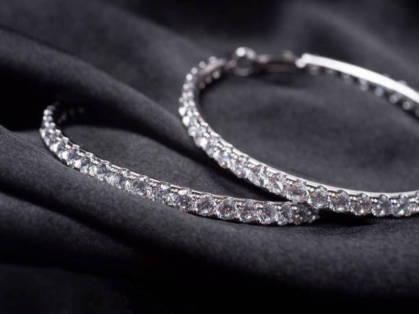 istock Very beautiful earrings with diamonds on a black background 1508771418