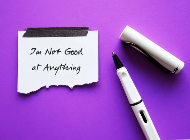 istock Pen and stick note on purple background with handwritten text - Im Not Good at Anything - concet of self limiting beliefs, everyone possesses unique talents and must find out their strengths 1508785199