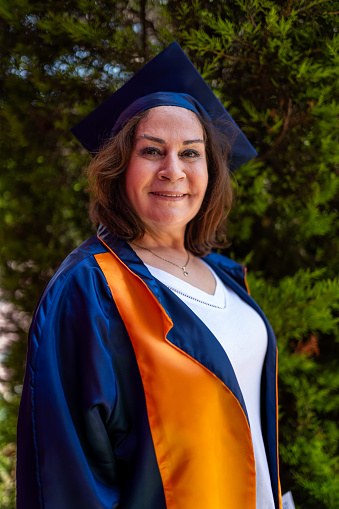 Senior woman in college graduation gown