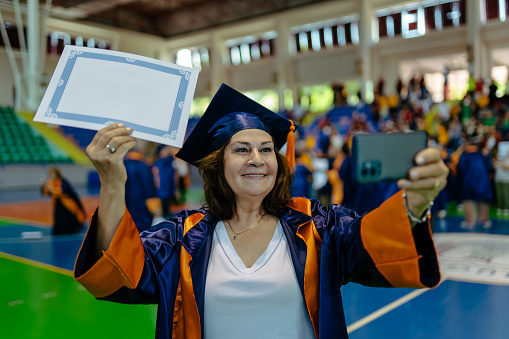 Senior woman in college graduation gown