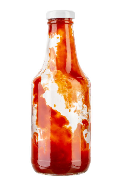 Open bottle of ketchup on isolated with white background. File contains clipping path. Full depth of field. Open bottle of ketchup on isolated with white background. File contains clipping path. ketchup-splash stock pictures, royalty-free photos & images