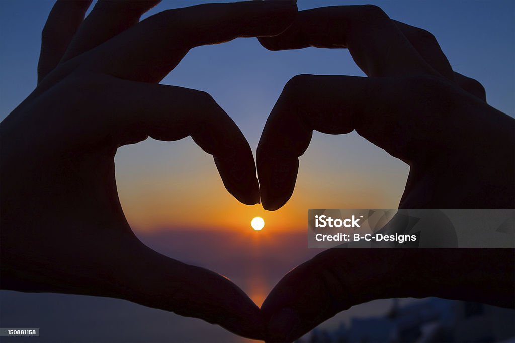 Romantic Sunset Heart Two hands make a heart by sunset Adult Stock Photo