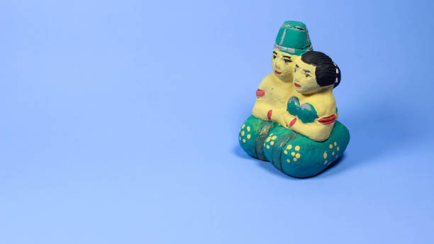 istock Small statue in the shape of a Javanese bride isolated on soft light blue color background 1508824142