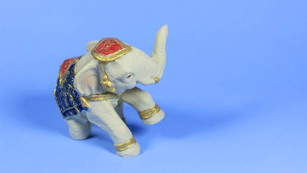 istock Small White Thai elephant statue isolated on soft light blue color background 1508824664
