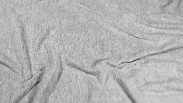 Textured gray cotton fabric with whirl pattern for background, wallpaper, copy space use.