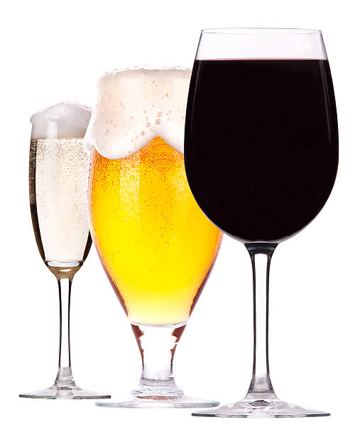 Three glasses of champagne, beer and wine stock photo
