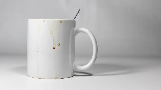 An empty mug with coffee marks stain stuck to the outside