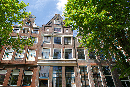 beautifully decorated facade of a house along one of the canals in Amsterdam