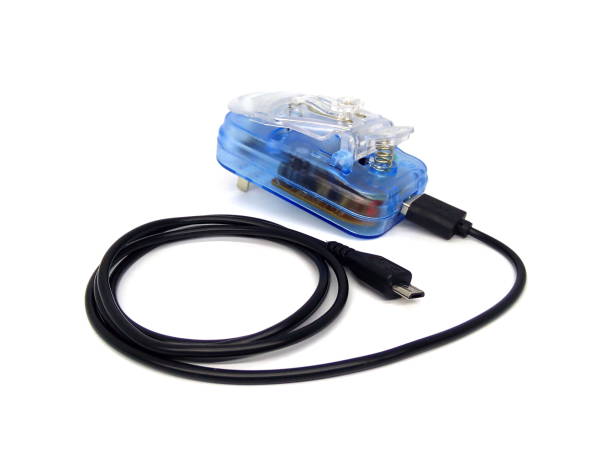 istock Blue mobile phone charger with USB cable isolated on white background. 1508880847