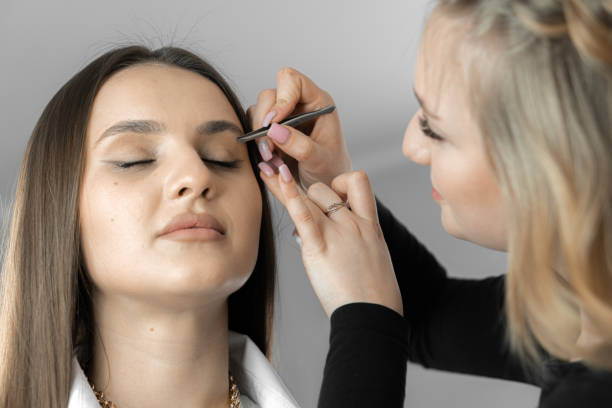 istock The eyebrow design master finds balance between naturalness and expressiveness adding charm and attractiveness to client's face. The makeup artist makes eyebrow correction. Beautician in beauty salon. 1508897971