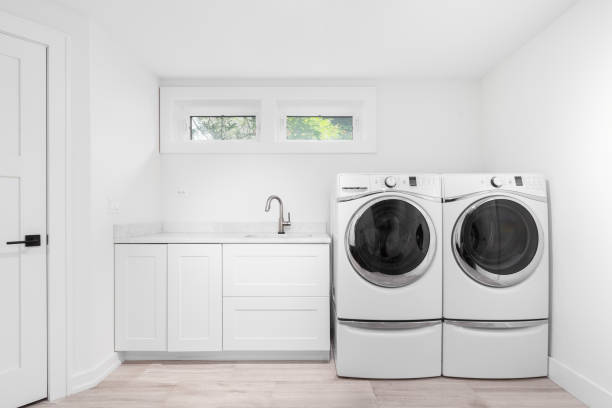 istock A laundry room with white cabinets and appliances. 1508900723