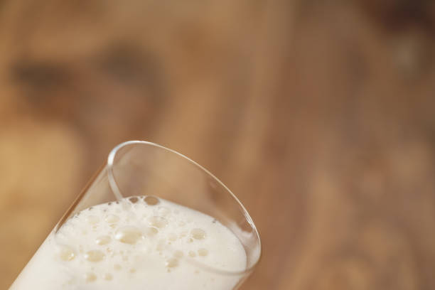 istock wheat beer poured in glass on wood table 1508901774