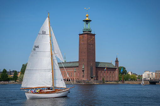 Beautiful boats and the city hall in background, Stockholm, Sweden