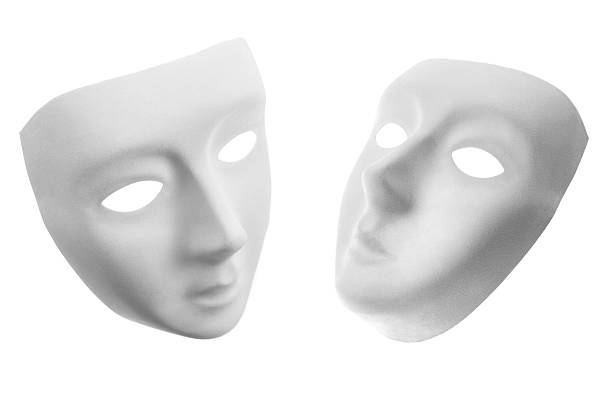 Two white masks isolated on white stock photo