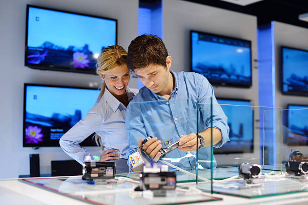 istock couple in consumer electronics store buying photo camera 150895481
