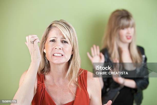 Upset Mother And Daughter Stock Photo - Download Image Now - Adult, Anger, Arms Crossed