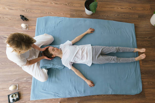 istock young masseuse does a Thai massage on the floor massaging her neck and shoulders 1508972560