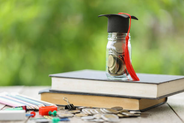 istock Knowledge and Success: Graduation Cap on Books Against a Beautiful Nature Background. Achievement Unlocked: Graduation Cap and Books Symbolize Education Savings and Academic Growth. 1508976952
