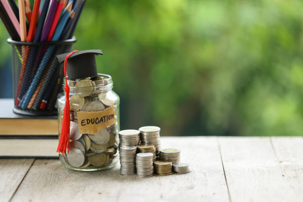 istock Knowledge and Success: Graduation Cap on Books Against a Beautiful Nature Background. Achievement Unlocked: Graduation Cap and Books Symbolize Education Savings and Academic Growth. 1508976983