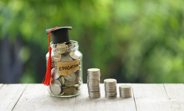 istock Knowledge and Success: Graduation Cap on Books Against a Beautiful Nature Background. Achievement Unlocked: Graduation Cap and Books Symbolize Education Savings and Academic Growth. 1508977188