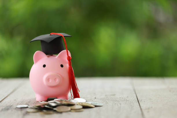 istock Knowledge and Success: Graduation Cap on Books Against a Beautiful Nature Background. Achievement Unlocked: Graduation Cap and Books Symbolize Education Savings and Academic Growth. 1508977229