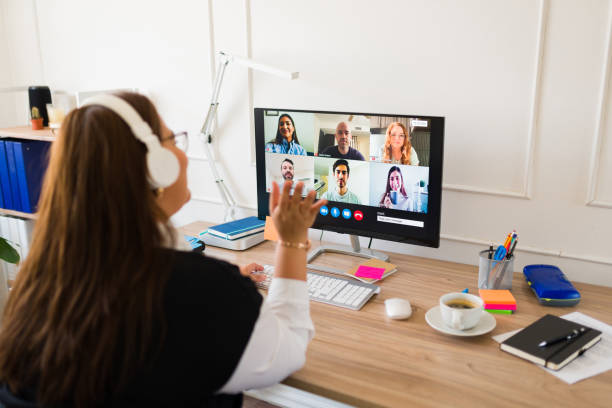 istock Professional woman seen from behind during a work video call 1508977511