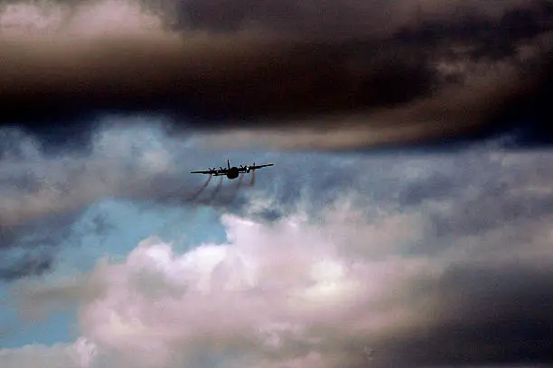 A C-130 approaches for a training drop