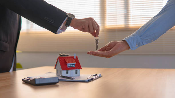 istock House developers and customer shaking hand after accept agreement finish buying or rental real estate for transfer right of property. 1508996439