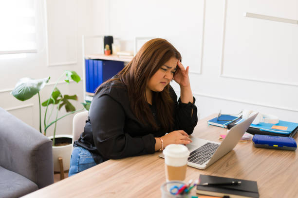 istock Stressed woman manager with work problems at her office desk 1509003803