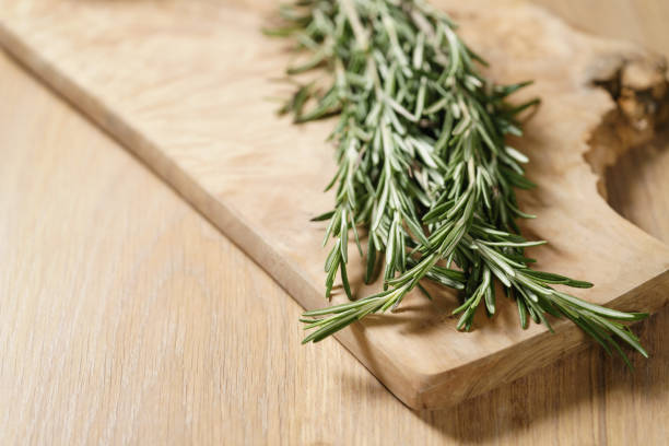 istock fresh rosemary bunch on wood table 1509006195