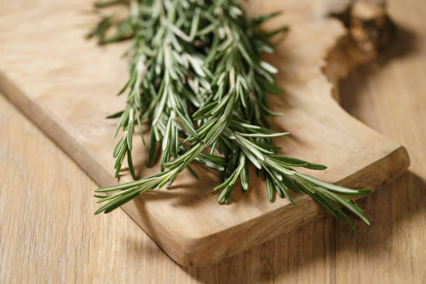 istock fresh rosemary bunch on wood table 1509007122