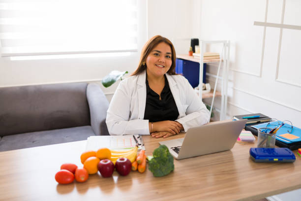 istock Smiling fat nutritionist feeling happy working in her office 1509008479