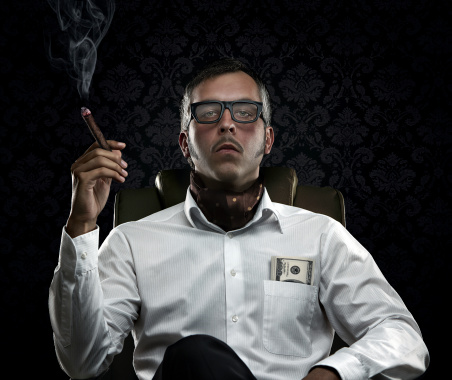 Funny portrait of rich man with serious face expression smoking cigar