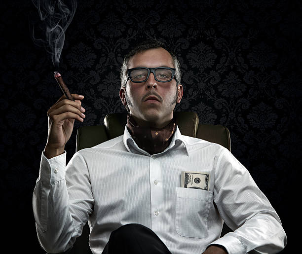 Portrait of serious rich man with money and cigar Funny portrait of rich man with serious face expression smoking cigar mafia boss stock pictures, royalty-free photos & images