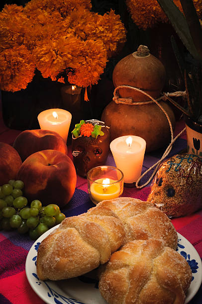 Day of the dead offering altar (Dia de Muertos) Offering as part of the celebration of the day of the dead in Mexico with bread religious offering stock pictures, royalty-free photos & images