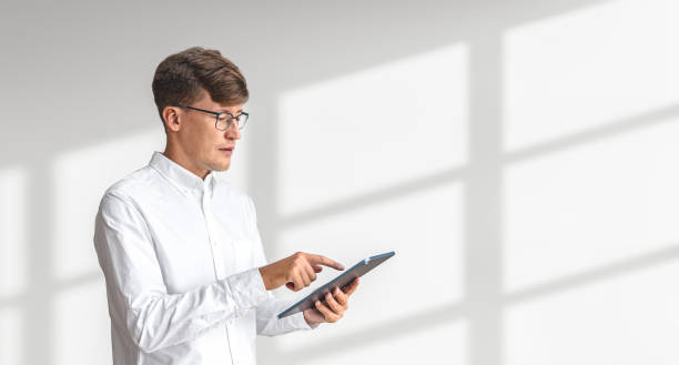 istock Businessman with tablet in hand, typing on copy space white background 1509017623