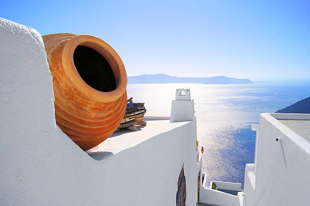View out to sea over the white walls of Santorini, Greece